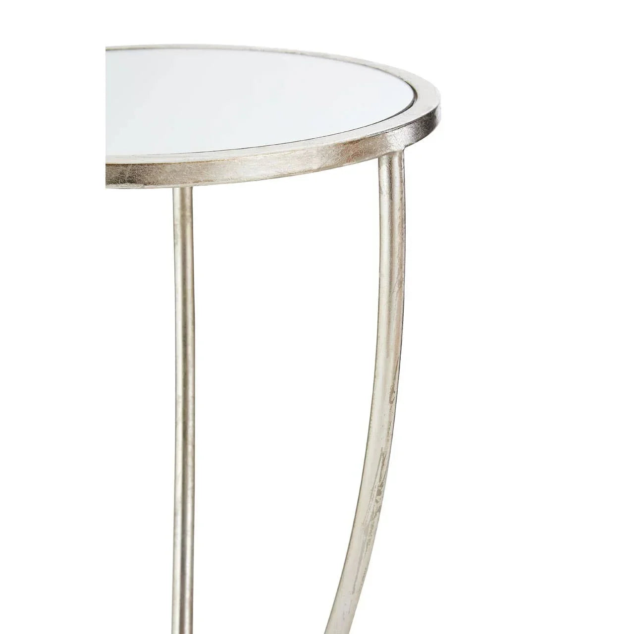 Round side table with glass top and silver metal frame, partial side view