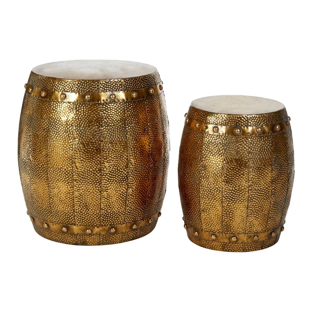 Set of two hammered gold metal side tables with round tops and decorative rivet accents