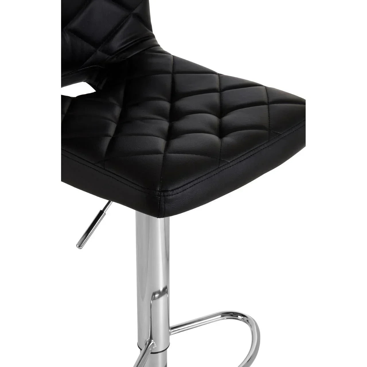Black leather bar stool with quilted seat and chrome base close-up