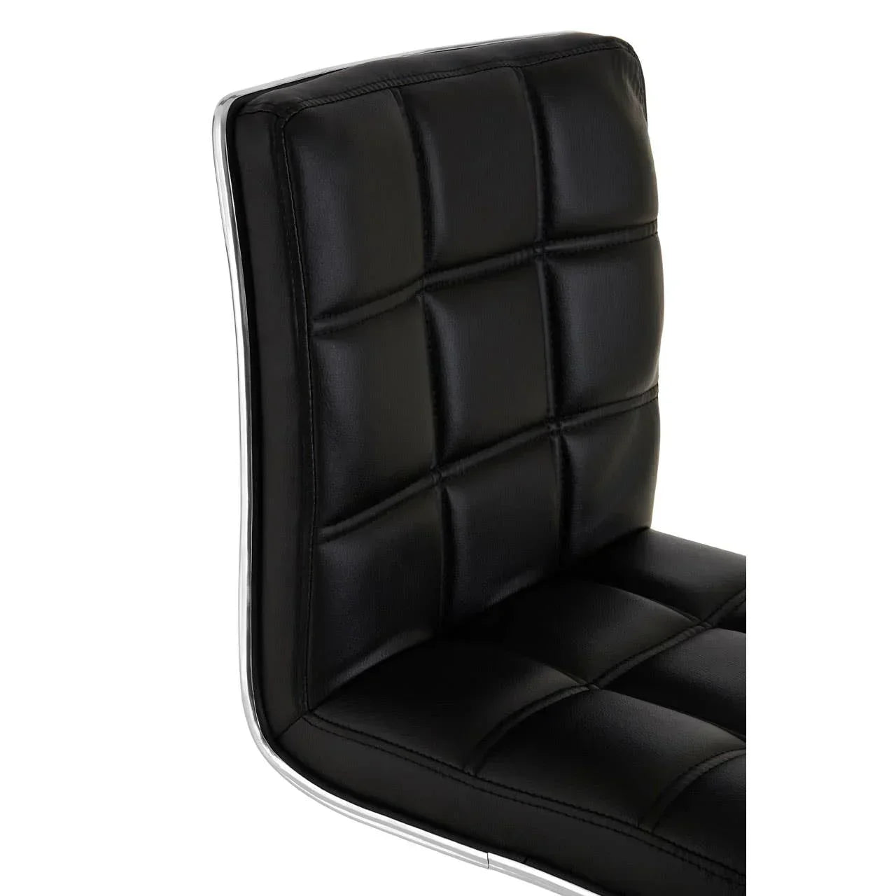 Black faux leather dining chair with chrome trim and square stitched padding, side angle view