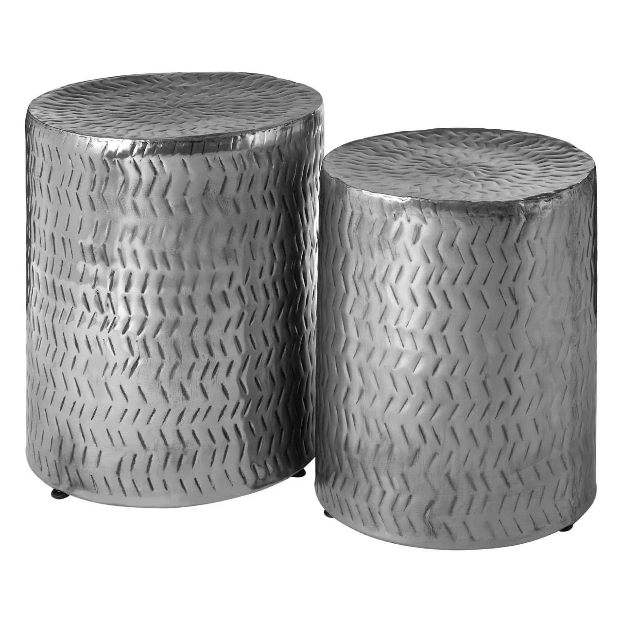 Set of two round silver metal side tables with textured surface and chevron pattern