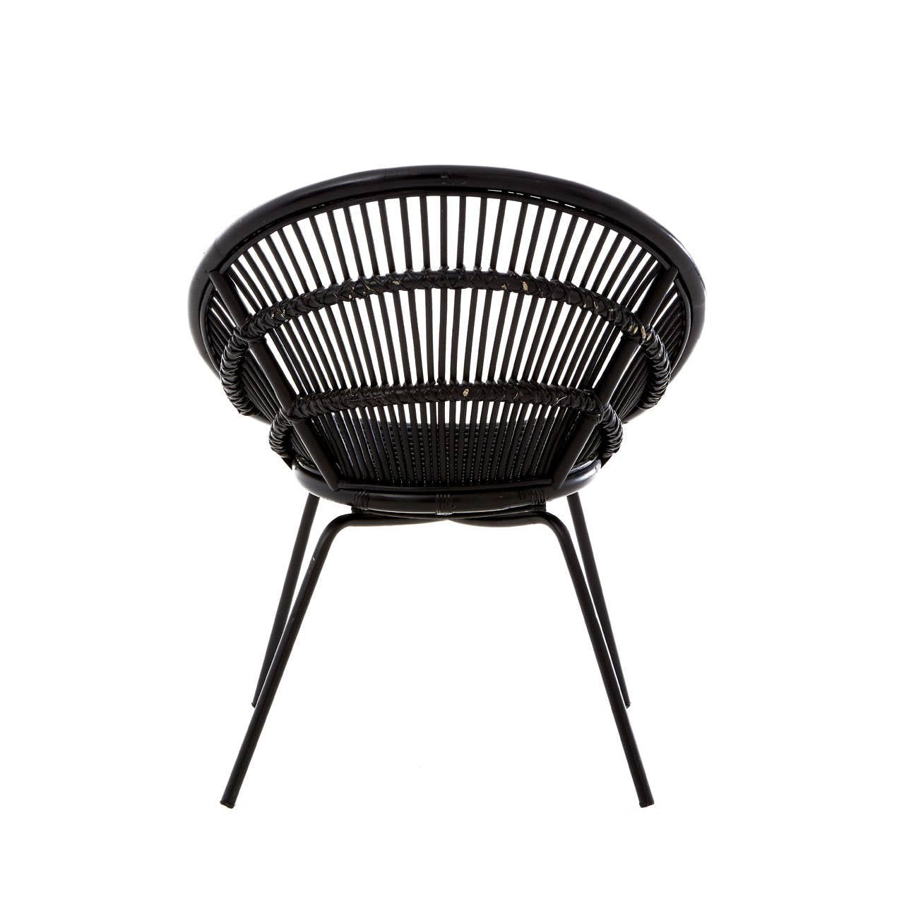 A round black rattan chair featuring a woven design and supported by sleek iron legs, showcasing a modern and minimalist aesthetic suitable for home decor