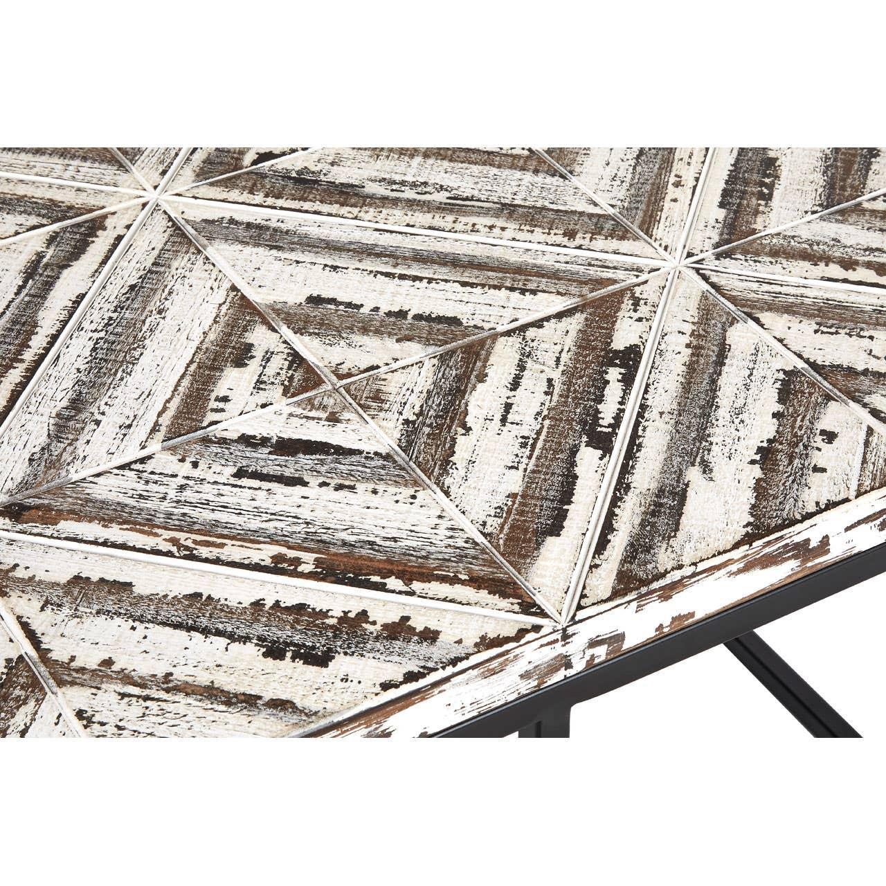 distressed wood dining table top with geometric panels and angled black metal legs