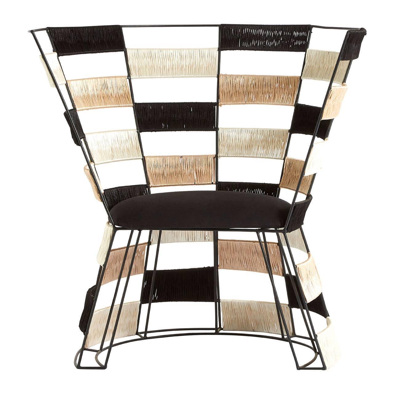 Modern accent chair with black metal frame and woven beige, black, and cream panels