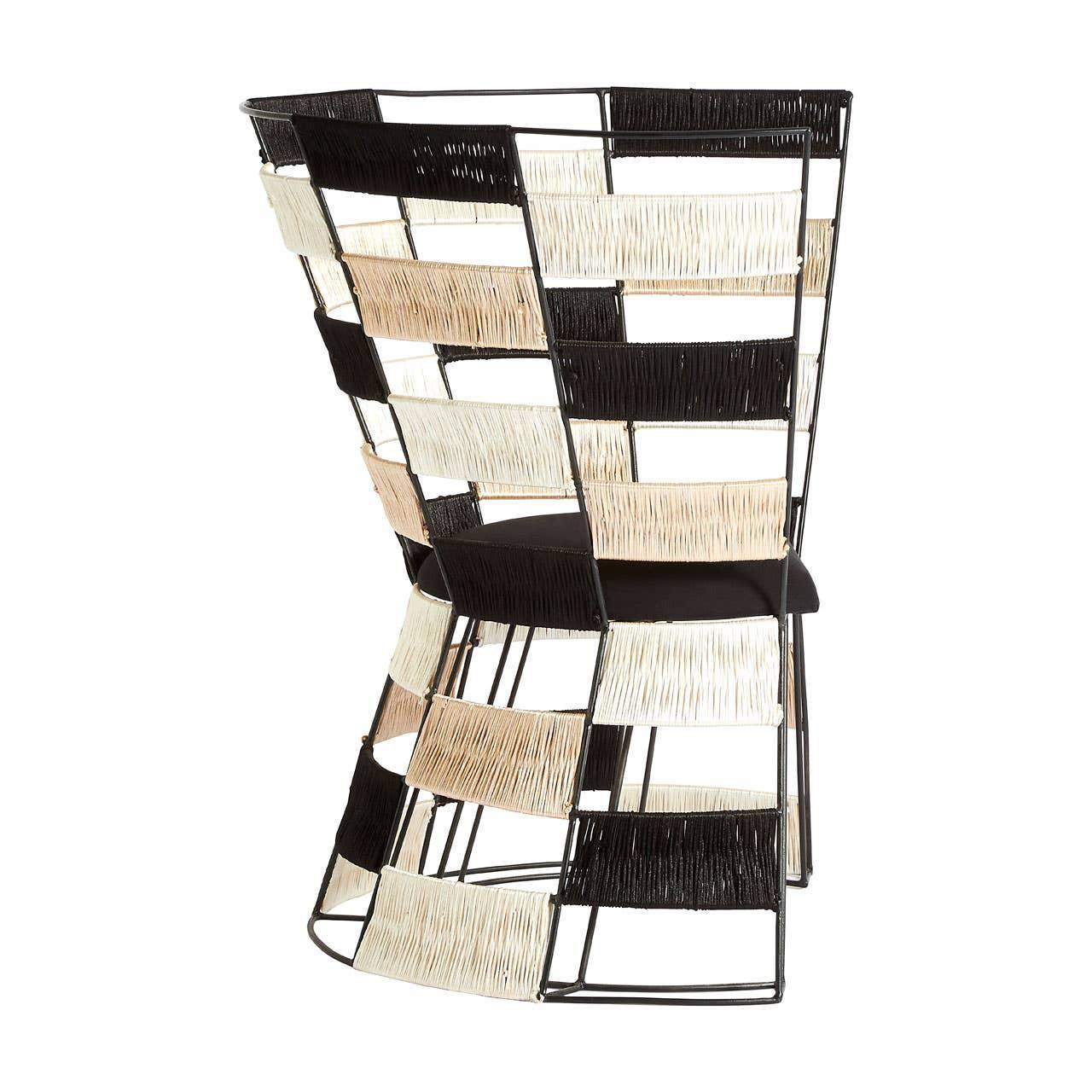 Modern accent chair with black metal frame and woven cream, beige, and black panels
