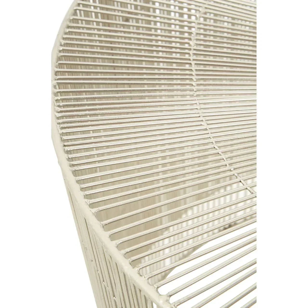 Close-up of cream metal wire chair seat with modern openwork design