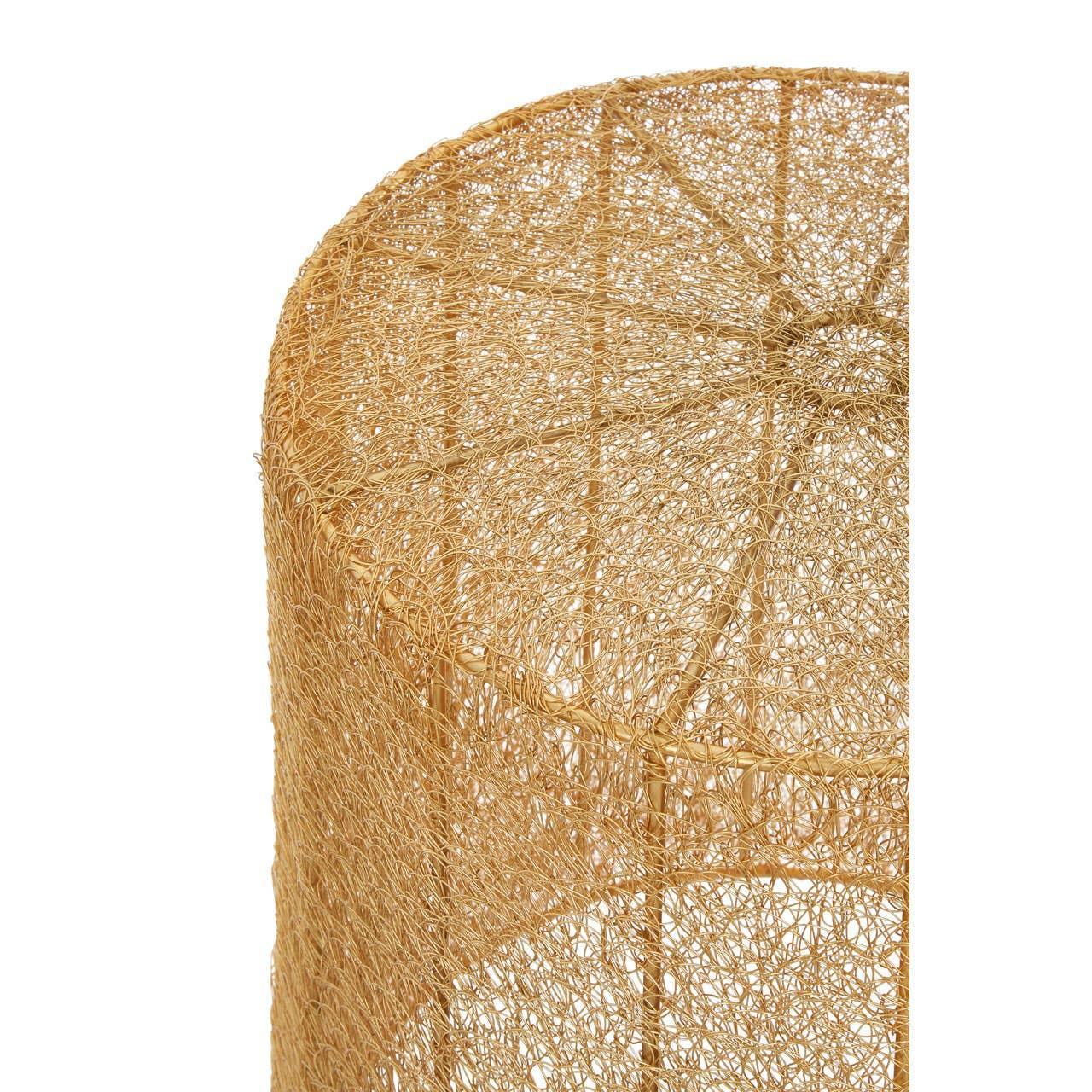 Close-up of woven rattan side table with natural finish and textured pattern