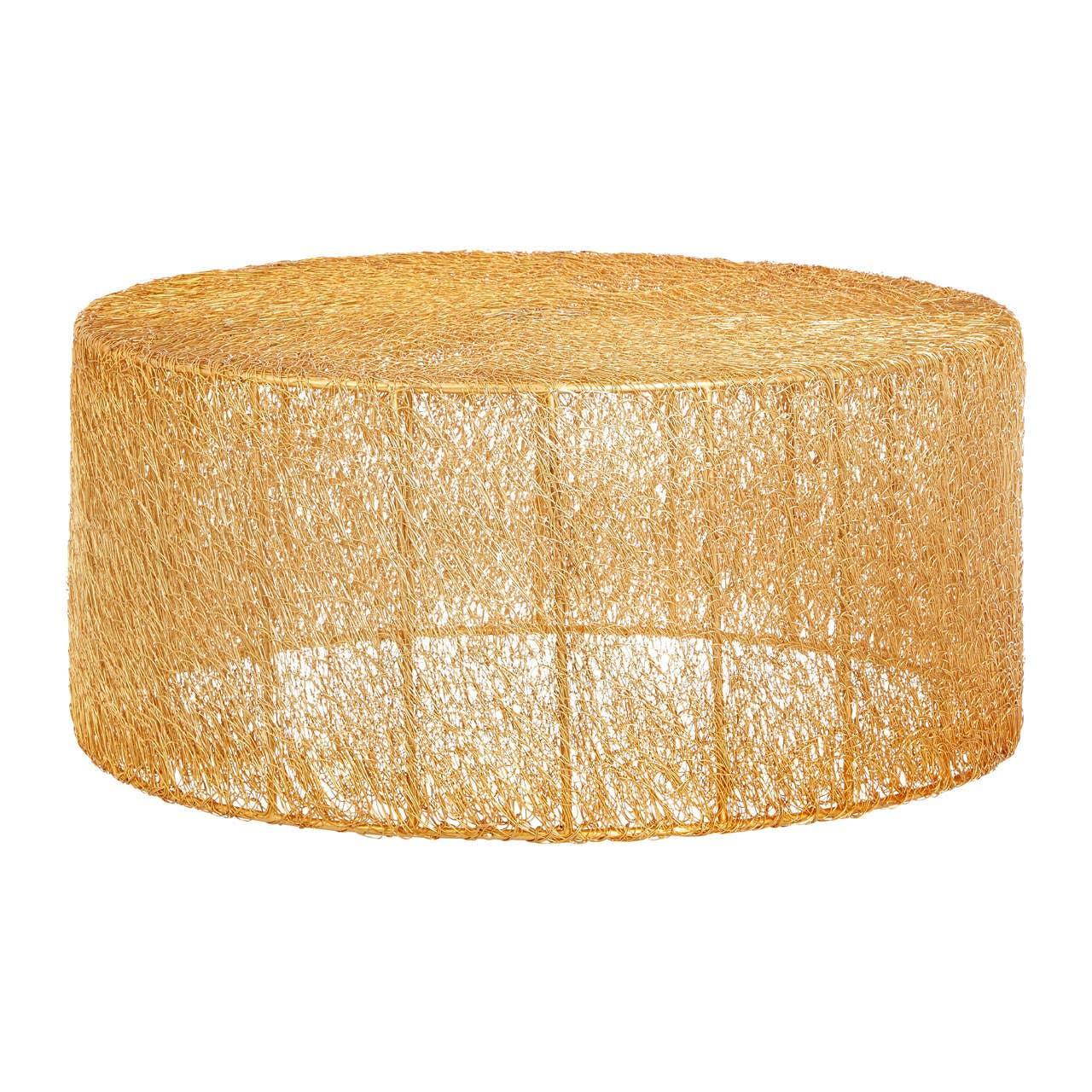 Round woven rattan coffee table with natural finish and open mesh design