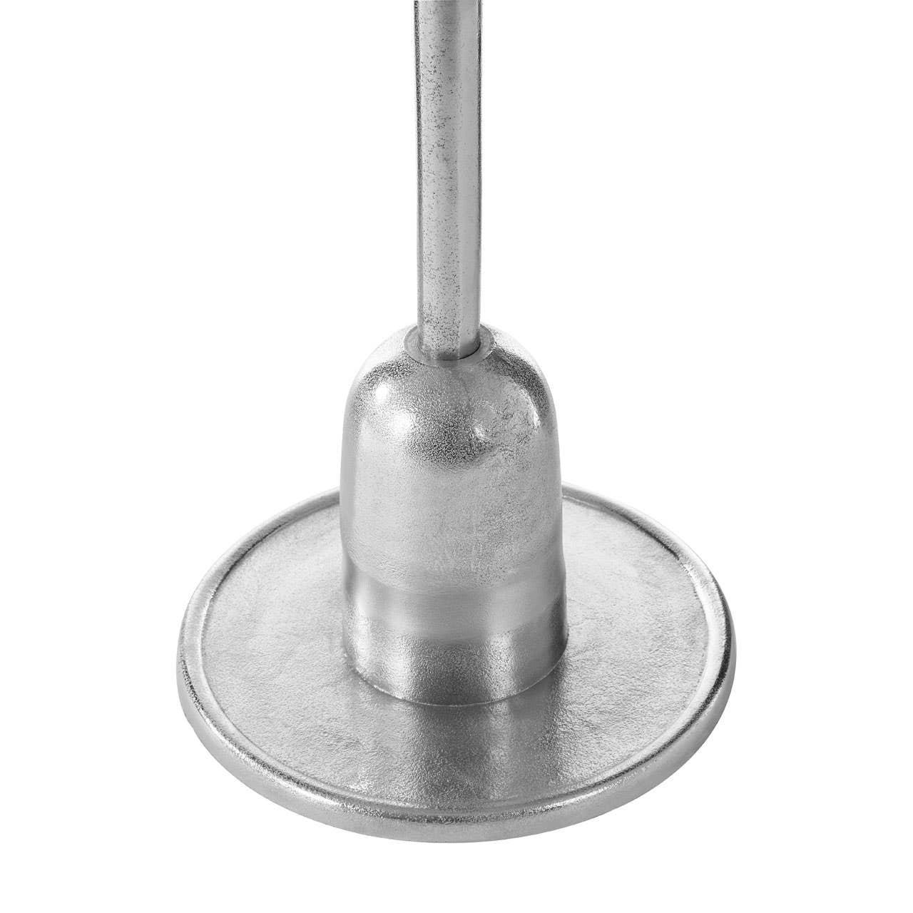 Silver metal lamp base with round textured detail, close-up view