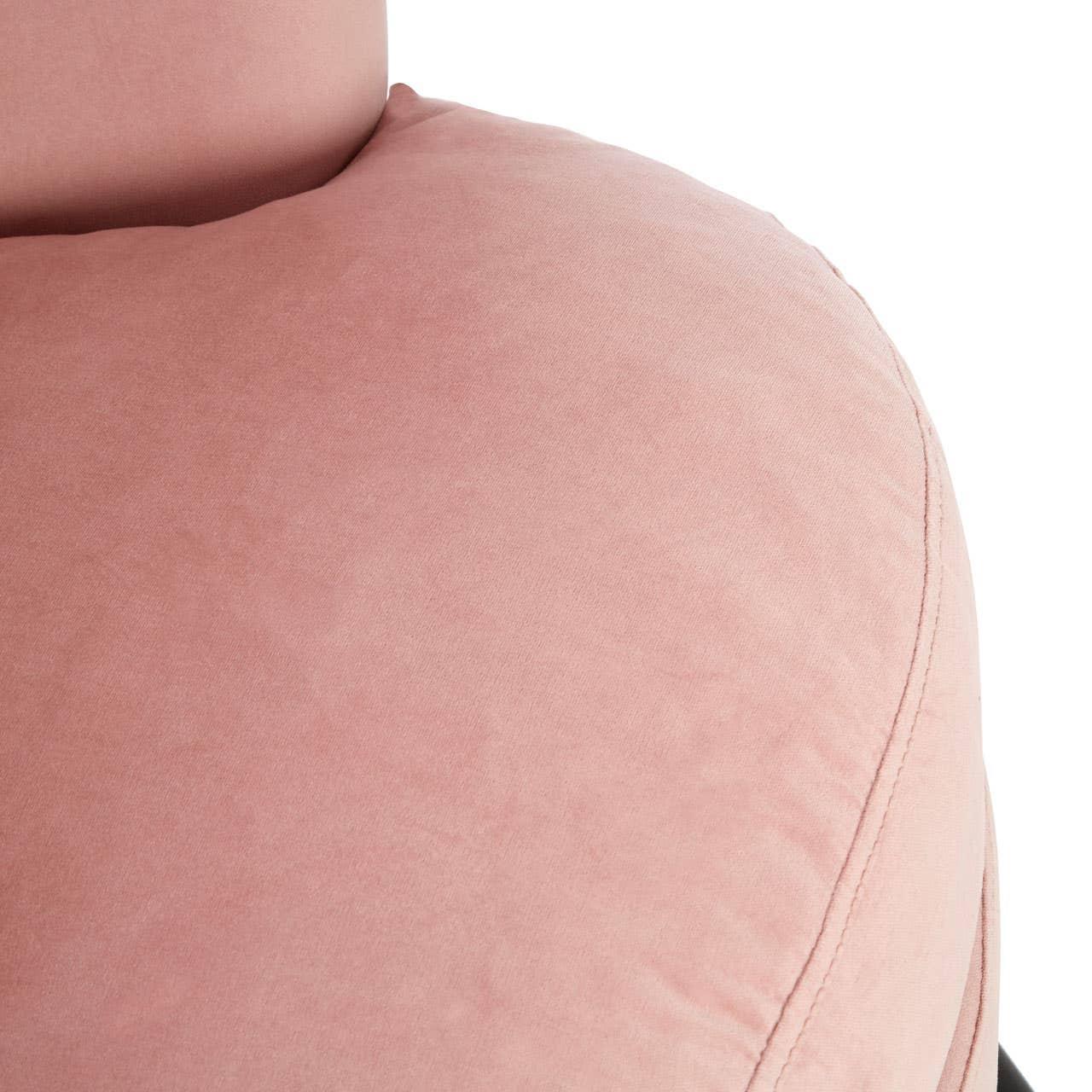 Close-up of pink velvet sofa seat with curved stitching detail