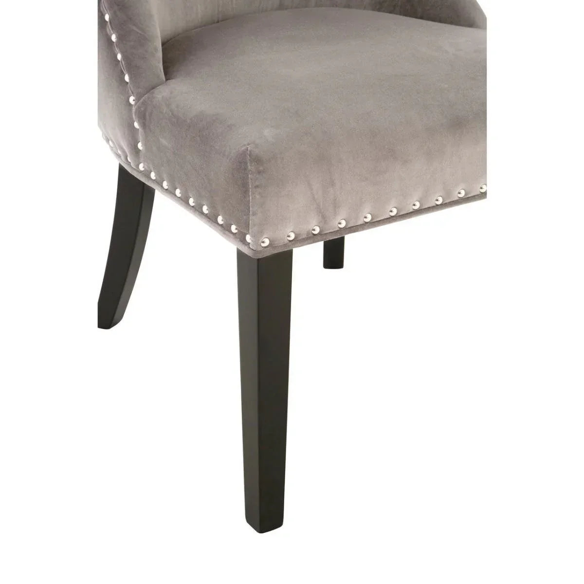 Grey velvet dining chair with silver stud trim and black wooden legs