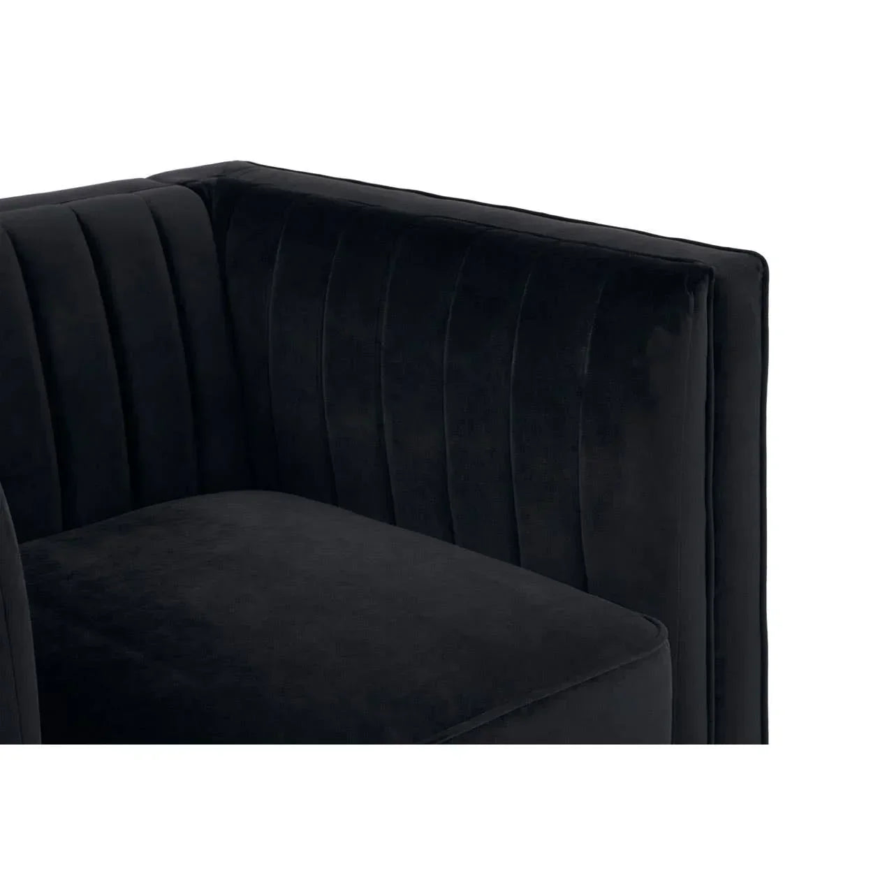 Black velvet sofa corner with vertical stitched panel detail