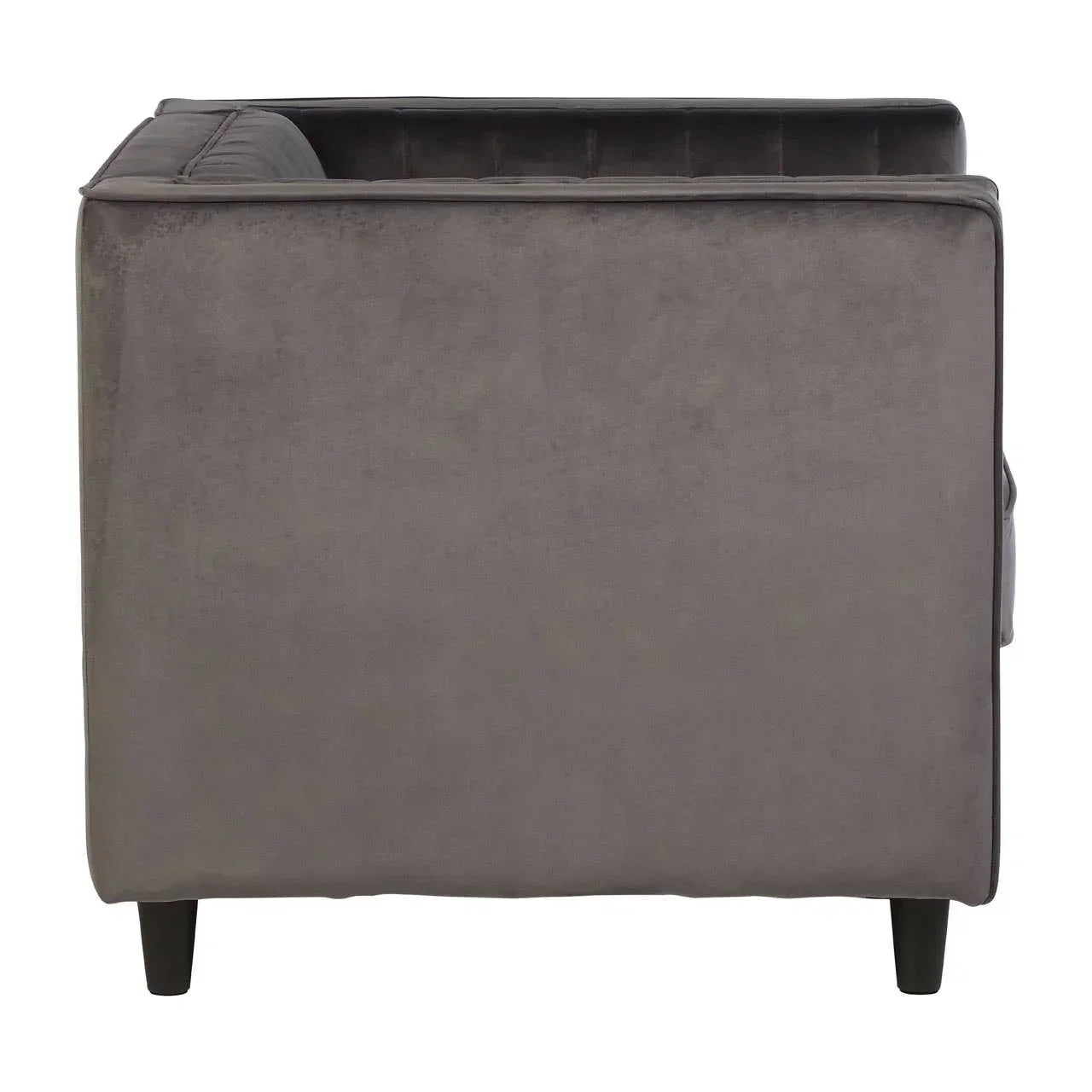 Side view of grey velvet sofa with straight armrest and dark wooden legs