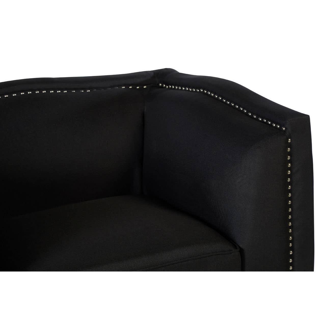 Black fabric sofa armrest with silver stud detailing and plush cushion