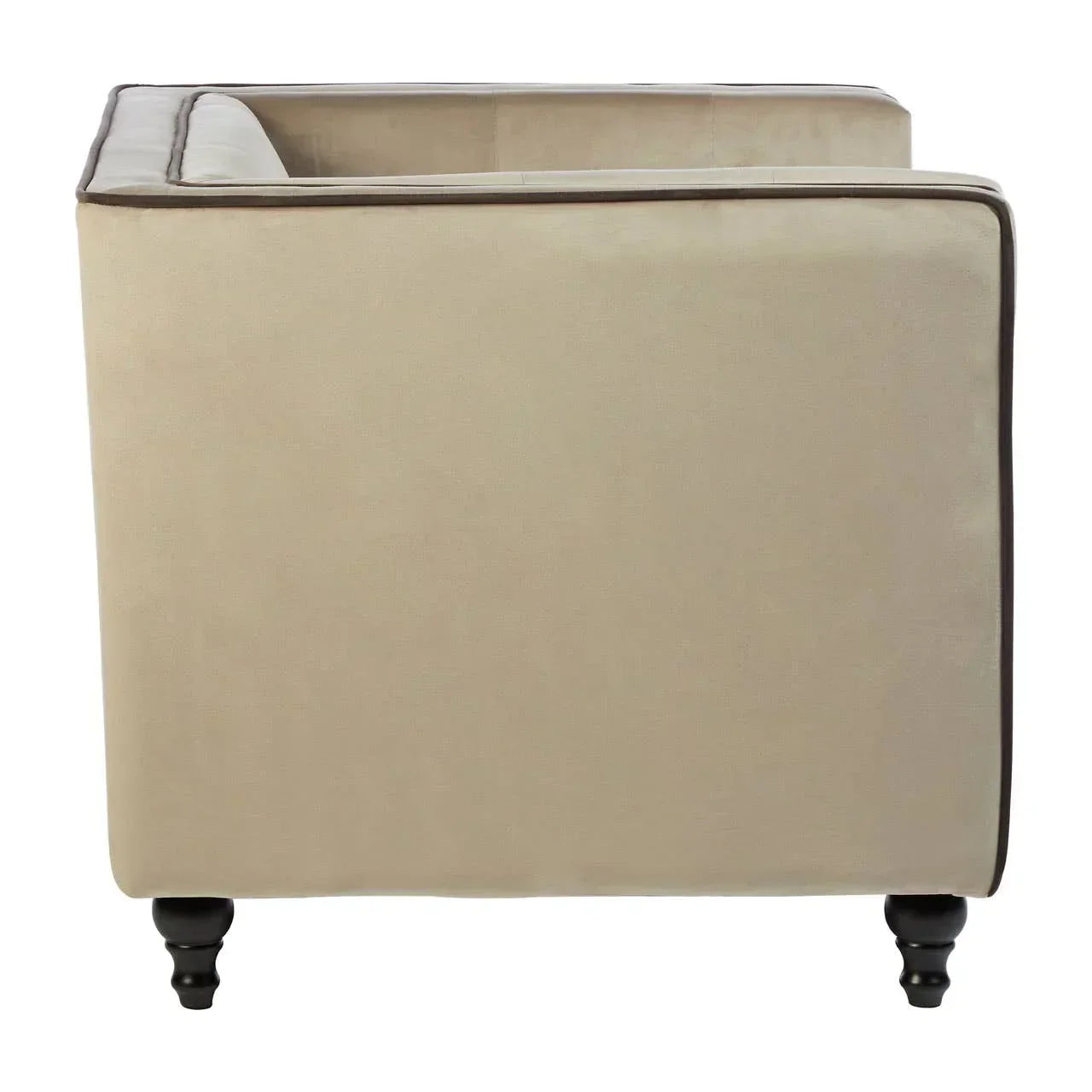 Side view of beige fabric sofa with dark turned wooden legs and piping detail