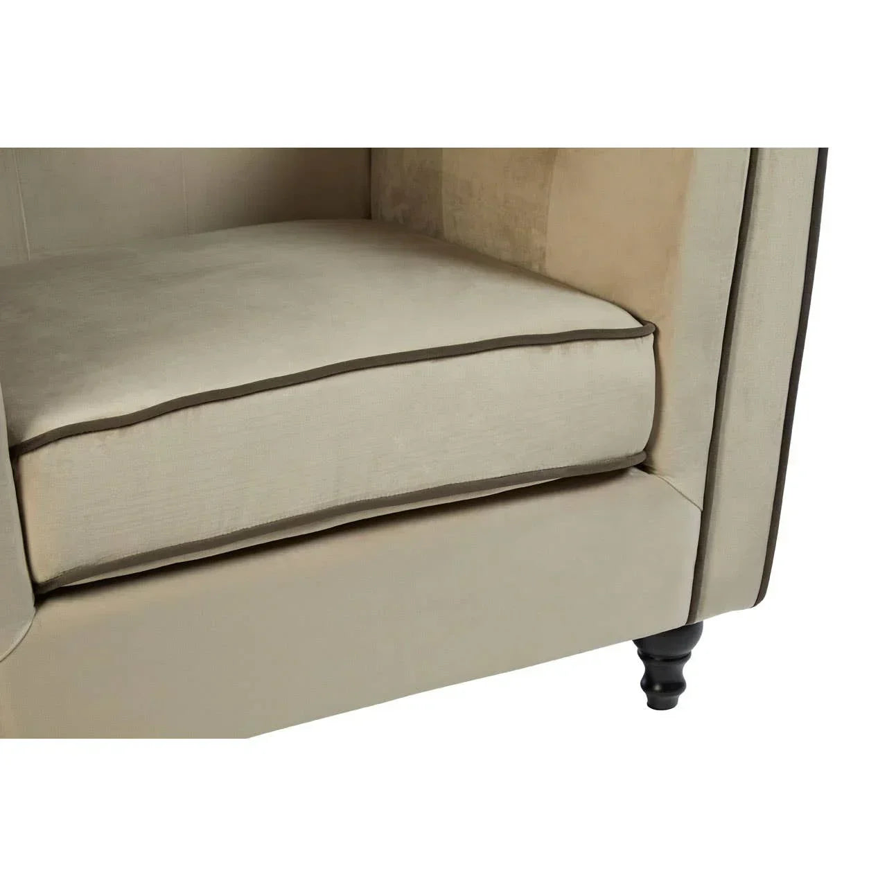 Beige fabric sofa seat cushion with piped edges and black wooden leg detail
