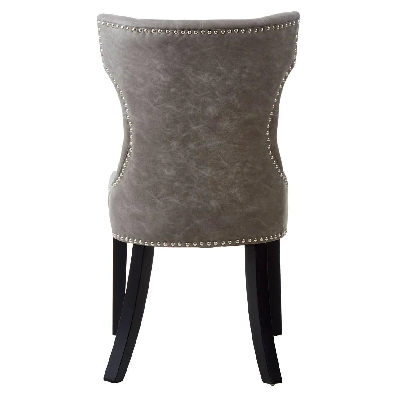 Grey studded dining chair with curved backrest and dark wooden legs, rear view