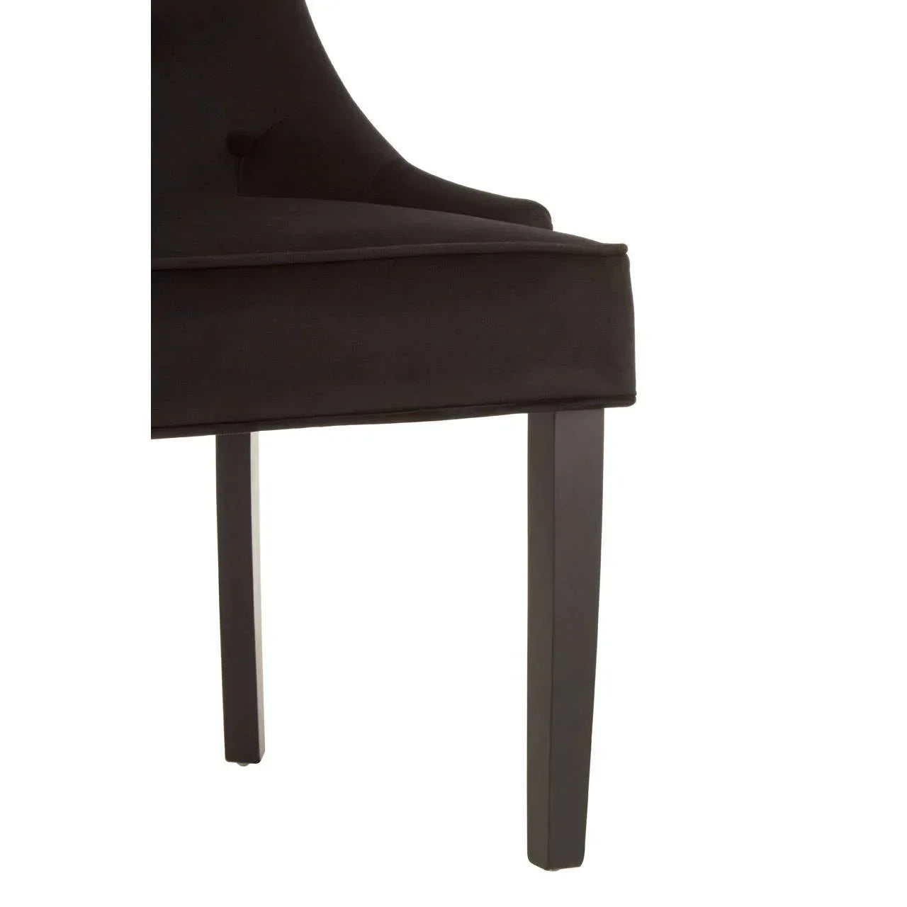 Closeup of black fabric dining chair with wooden legs