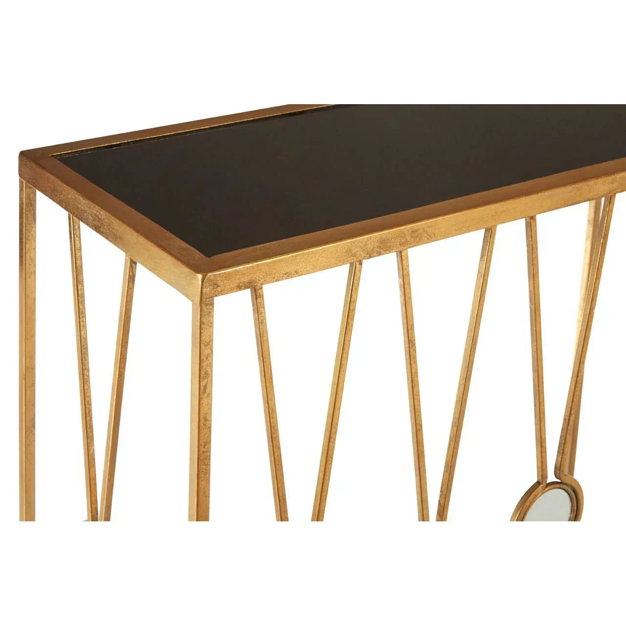 Gold metal console table with black top and geometric leg design