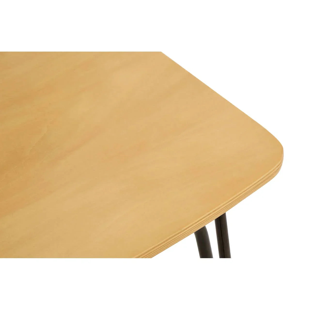 Closeup of light wood dining table corner with visible grain and black metal legs
