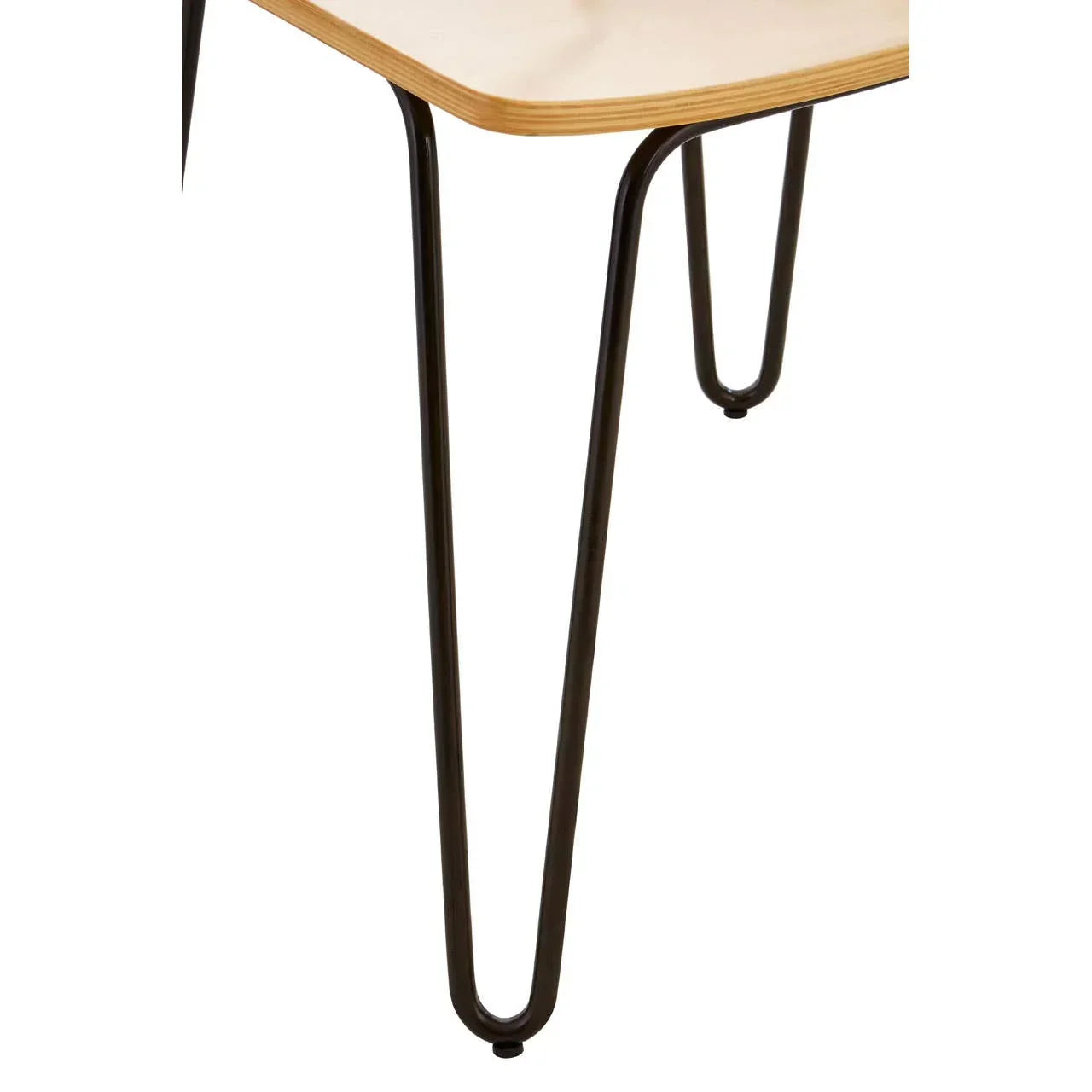 Close-up of wooden table top with black metal hairpin legs