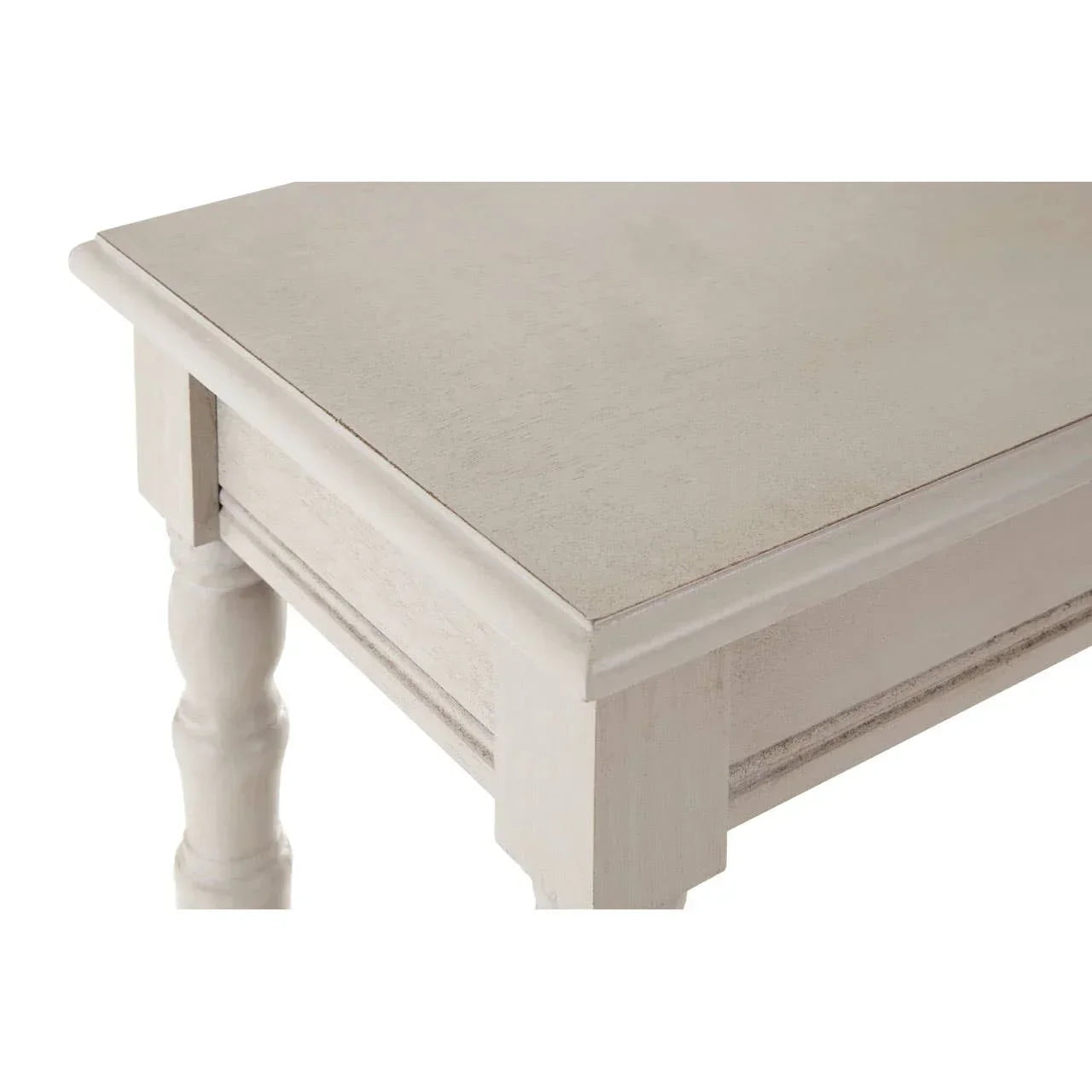 Light wood dining table corner with turned leg and beveled edge detail