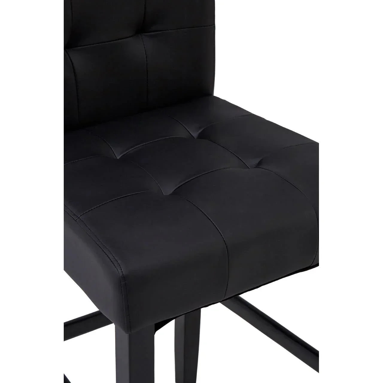 Black faux leather dining chair with tufted seat and backrest, close-up view