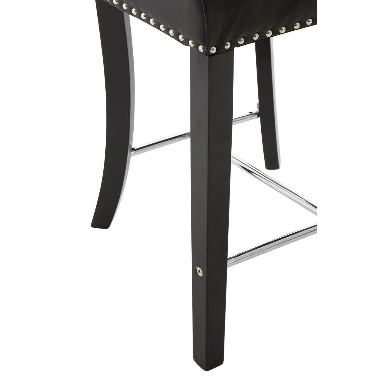 Black bar stool leg with chrome footrest and metal stud detailing on seat edge