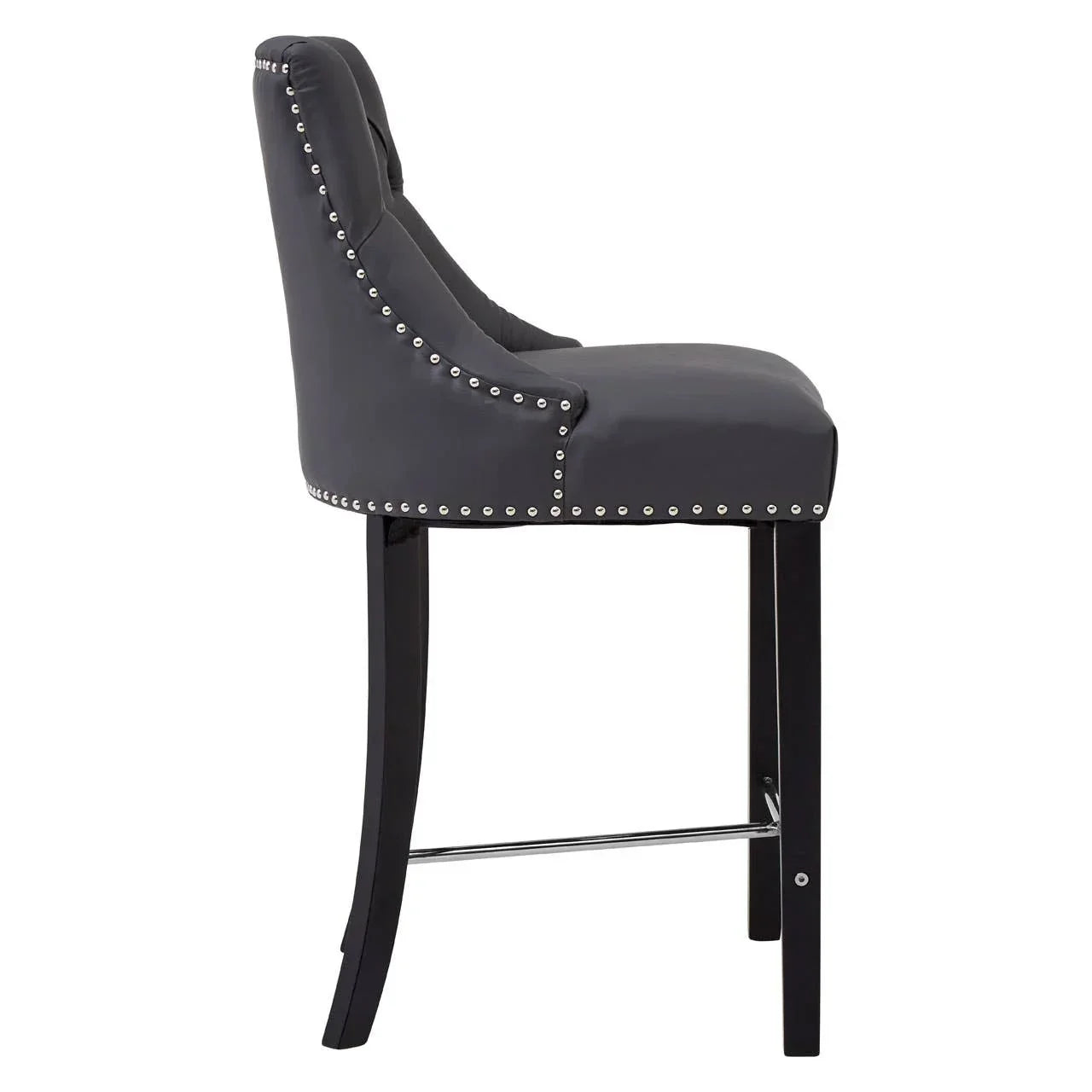 Grey leather bar stool with stud detailing and black wooden legs, side view