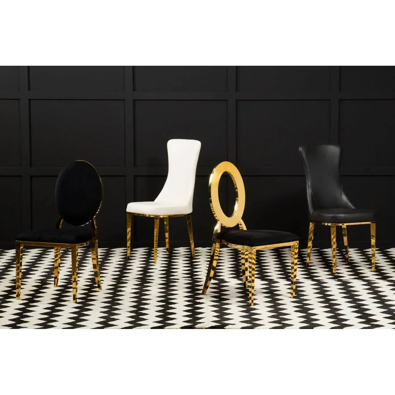 Modern dining chairs with gold frames and black or white upholstery on geometric floor