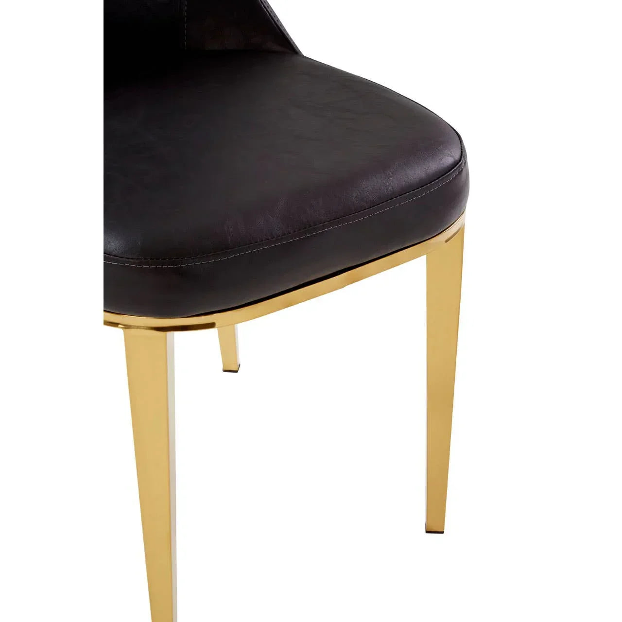 Black leather dining chair with gold metal legs, close-up seat and front angle