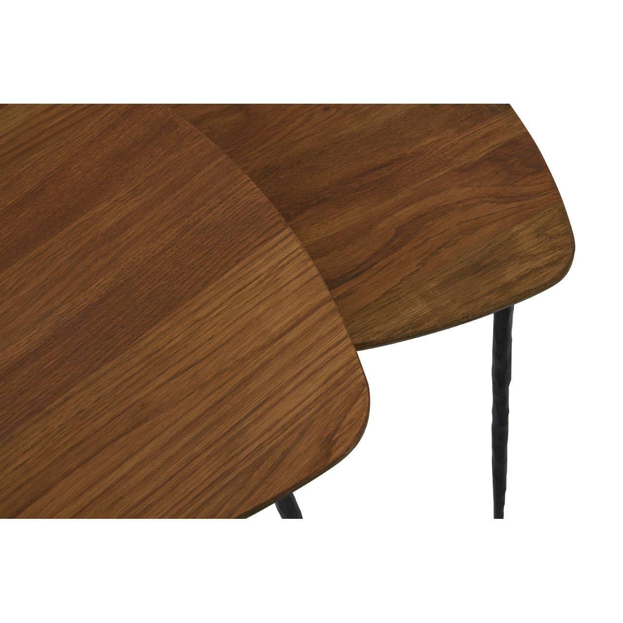 Close-up of two nested wooden side tables with black metal legs
