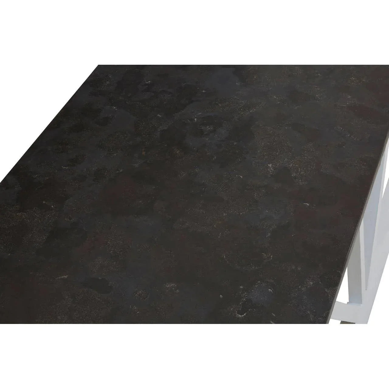 Closeup of dark stone dining table top with white metal legs