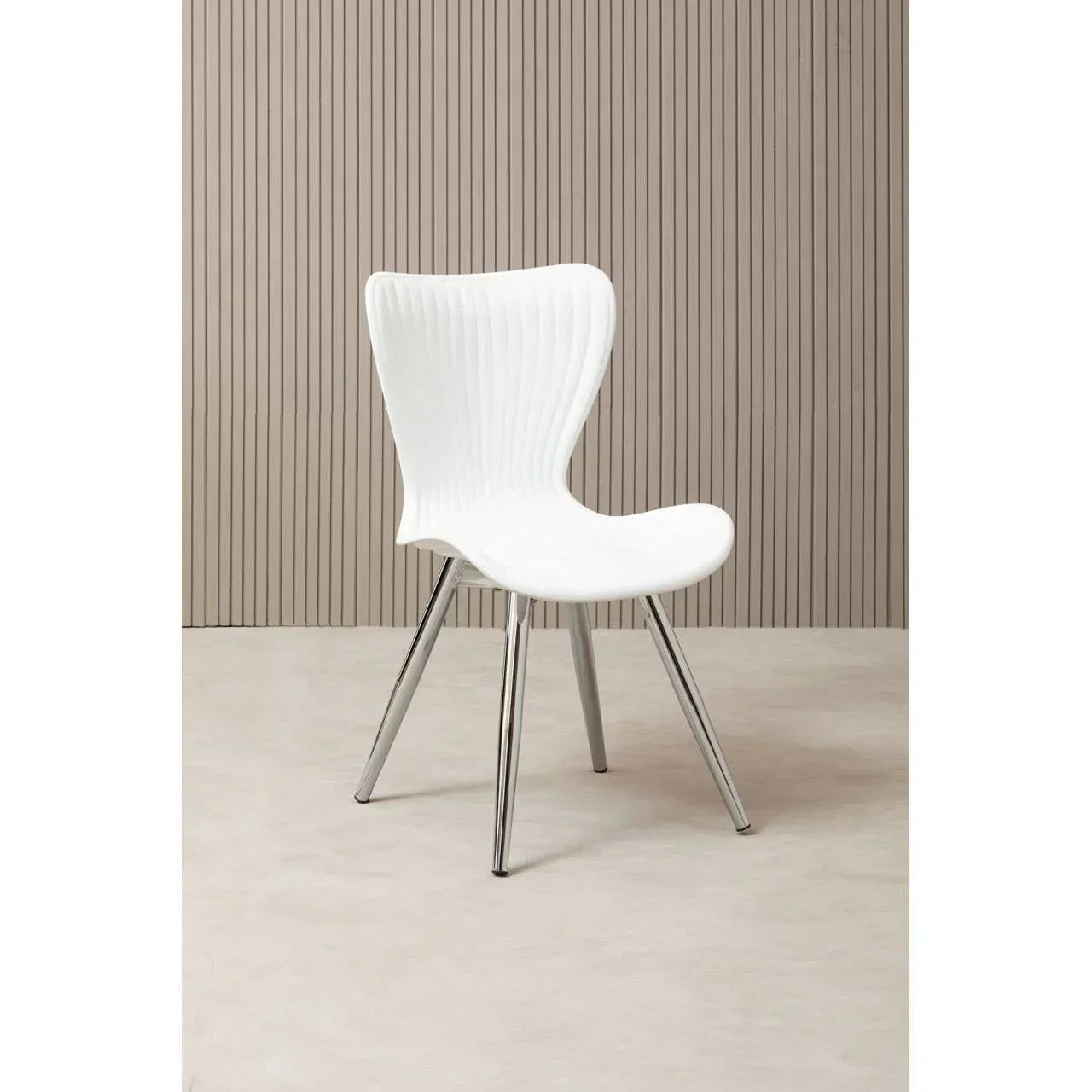 White modern dining chair with chrome legs on beige floor and vertical panel wall