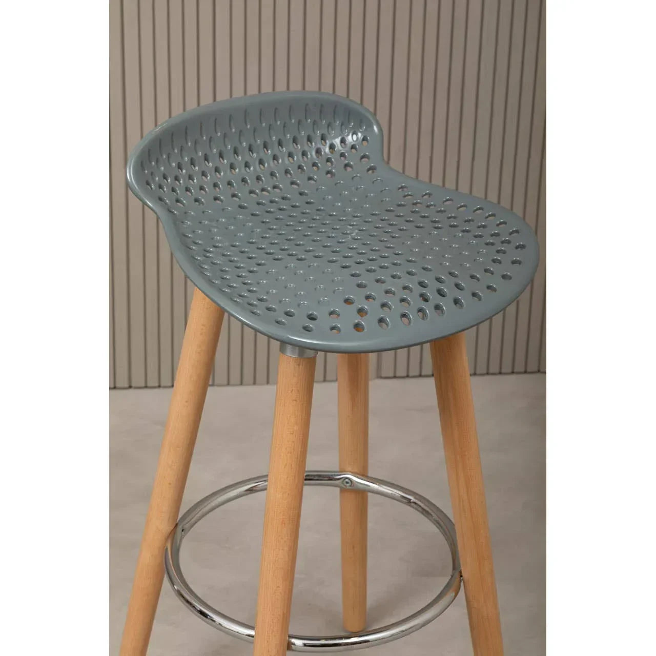 Modern grey bar stool with perforated plastic seat and wooden legs