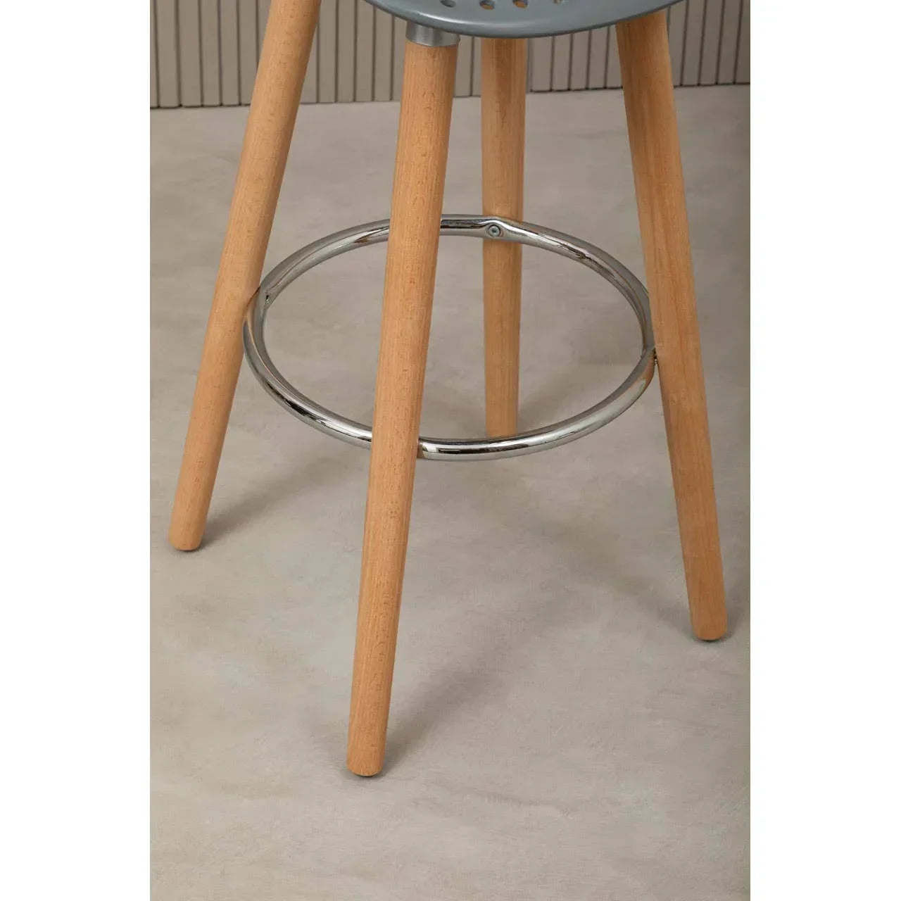 Bar stool wooden legs with chrome footrest on light floor