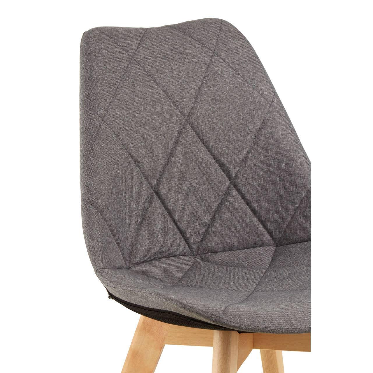 Grey fabric dining chair with diamond stitching and light wood legs, close-up view