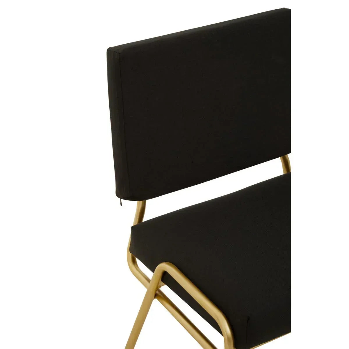 Black cushioned dining chair with gold metal frame, close-up of seat and backrest