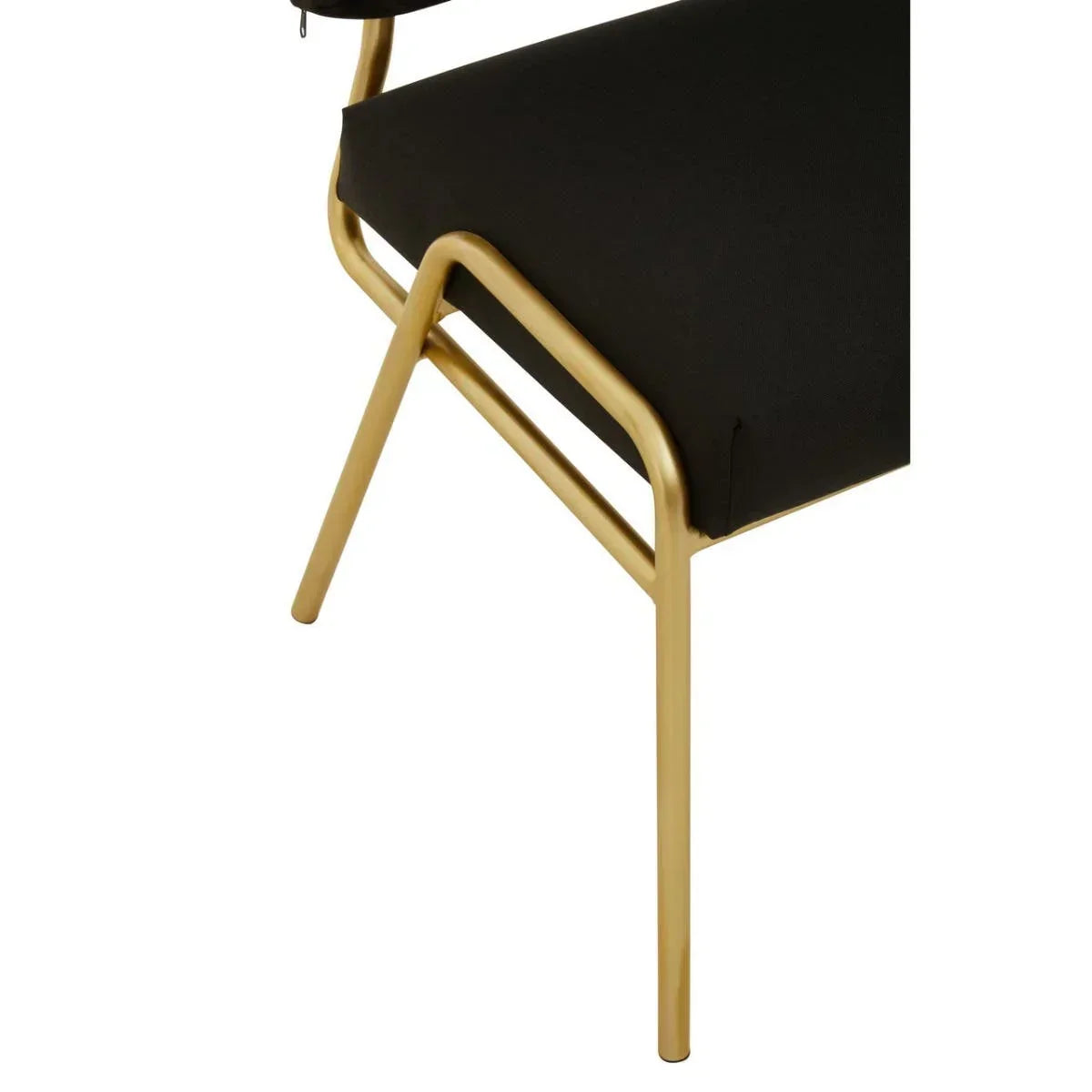 Black upholstered dining chair with gold metal frame close-up