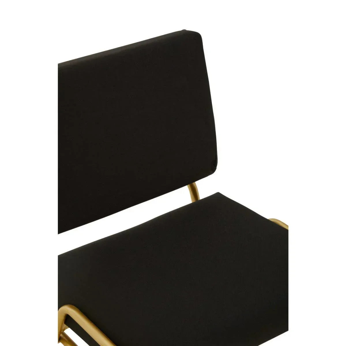 Close-up of black upholstered dining chair with gold metal frame