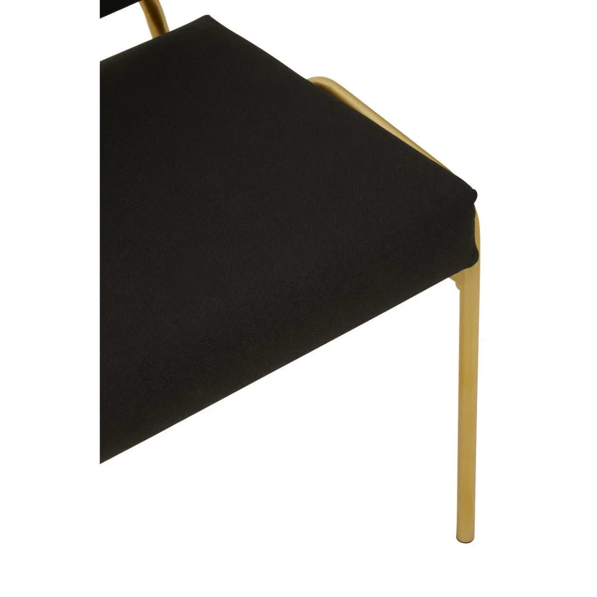 Black fabric dining chair with gold metal legs, close-up of seat and frame