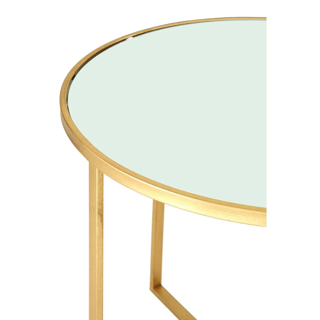 Round glass coffee table with gold metal frame, close-up of tabletop and leg