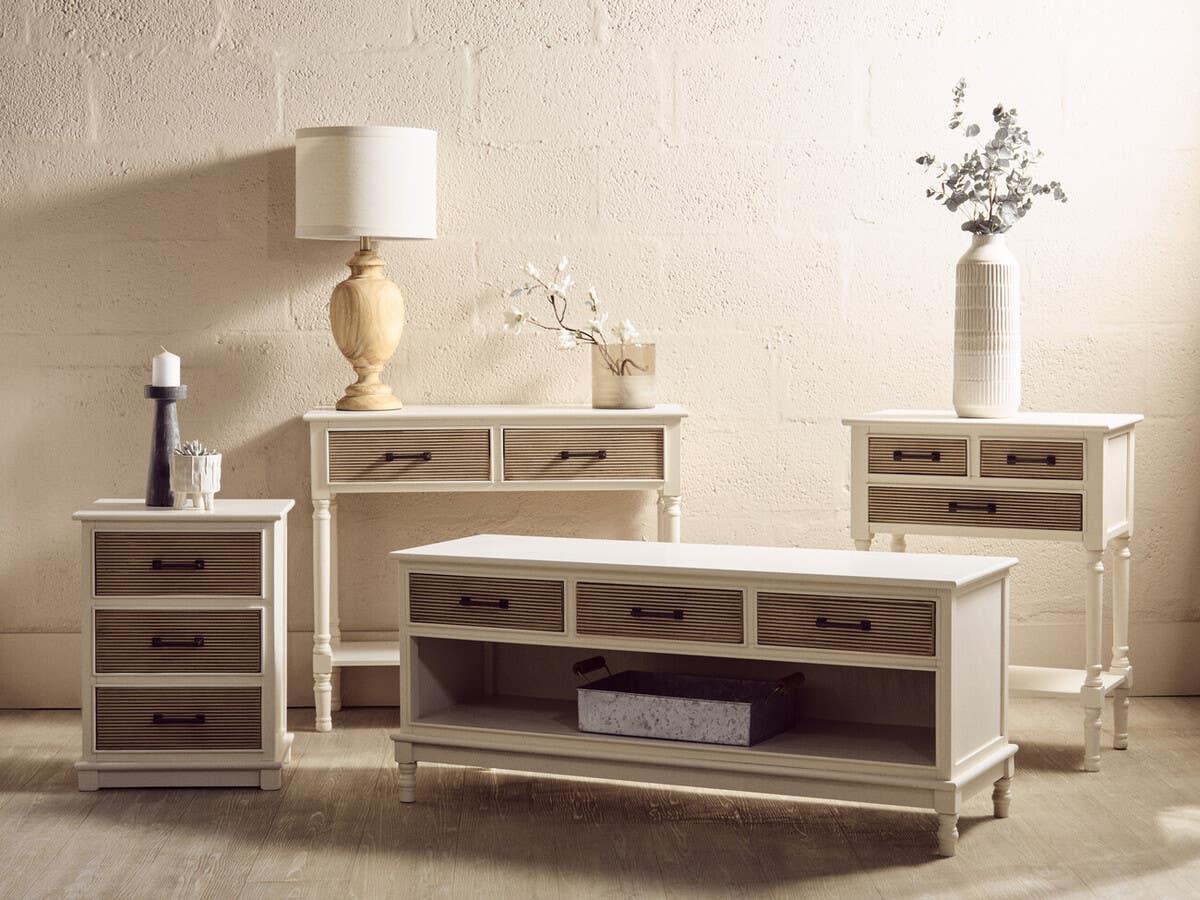 Cream and oak living room furniture set with drawers, shown with table lamp and vases