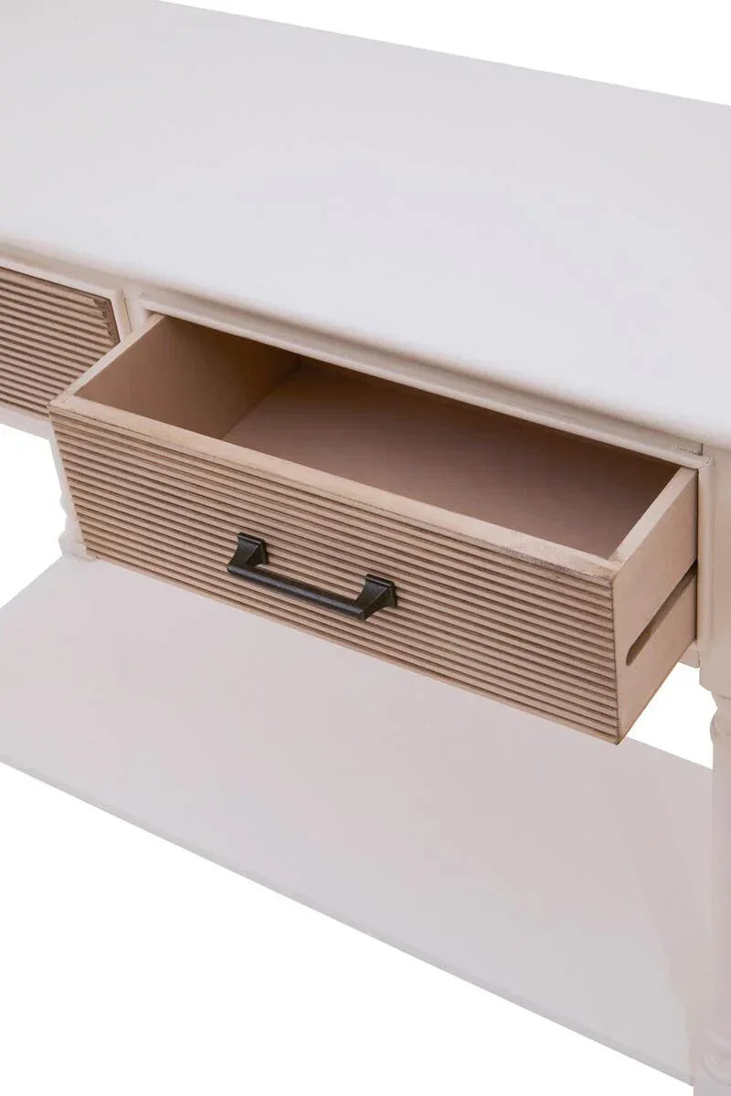 White wooden console table with open ribbed drawer and black handle, angled view