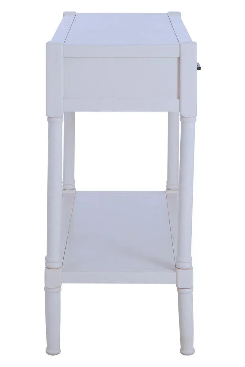 White wooden side table with lower shelf and turned legs, side angle view