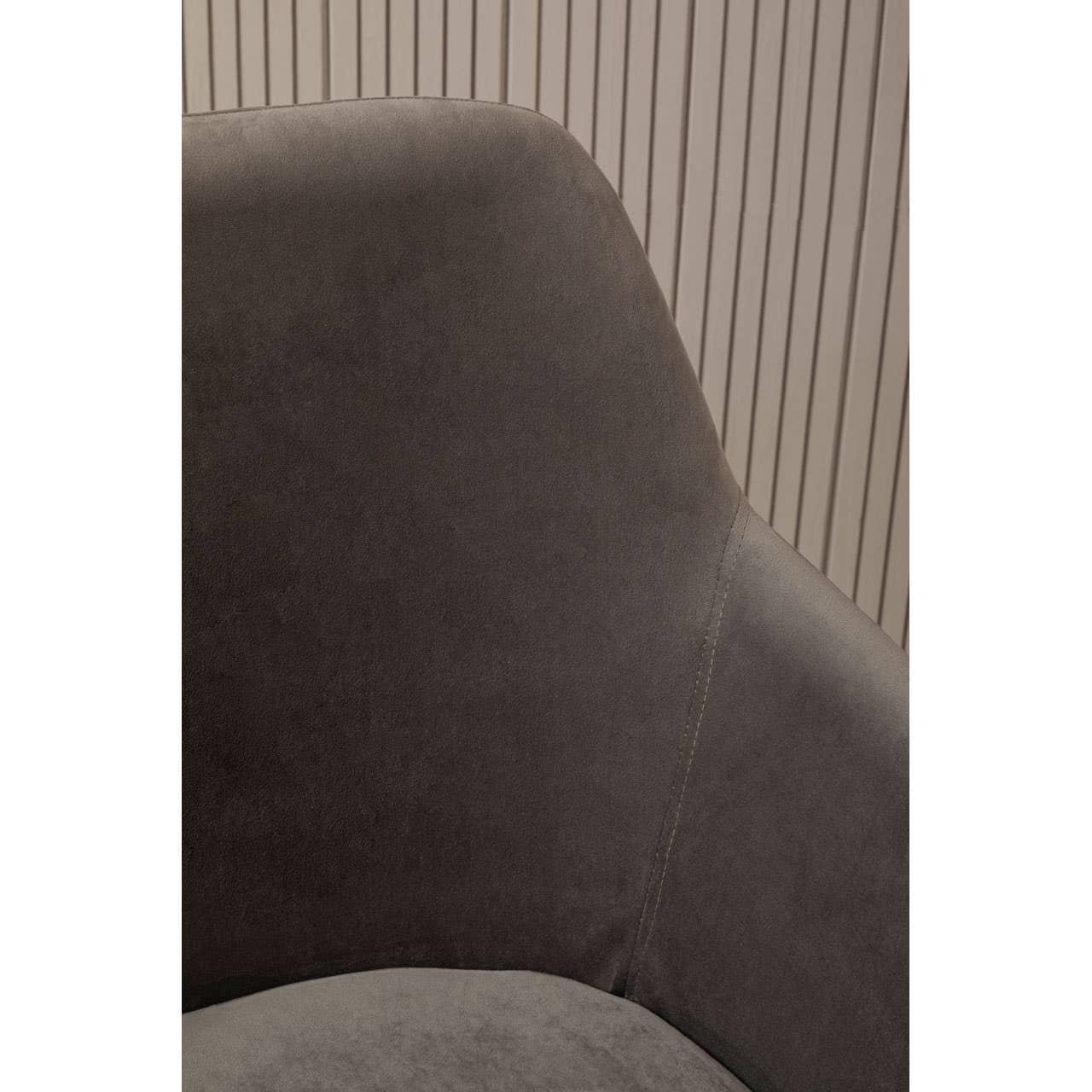 Close up of grey upholstered chair backrest with contrast stitching