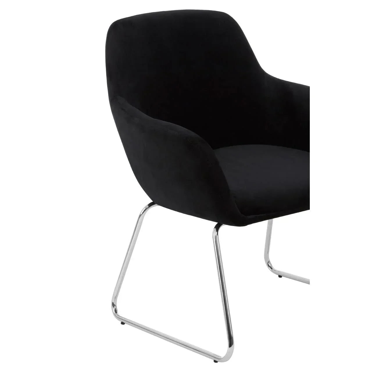 Black upholstered dining chair with chrome legs and curved armrests, angled side view
