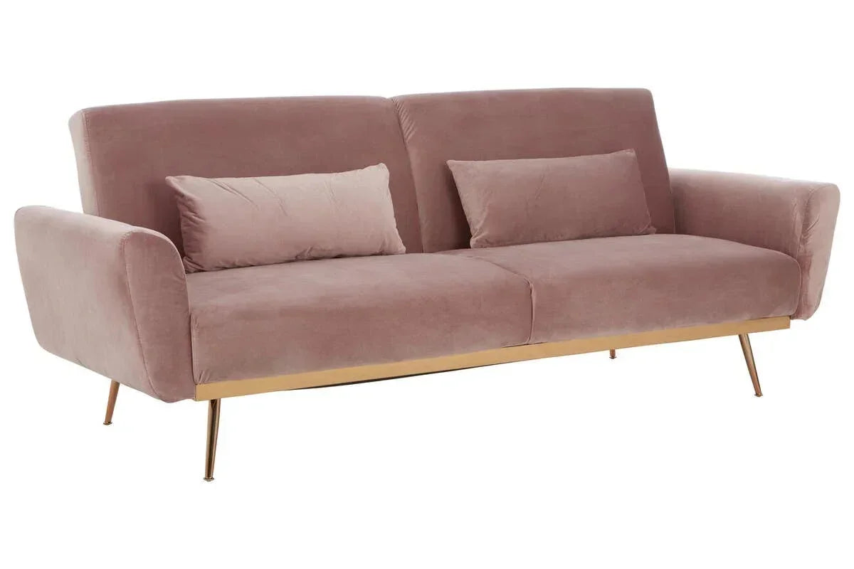 Blush pink velvet sofa with gold legs and matching cushions, angled front view