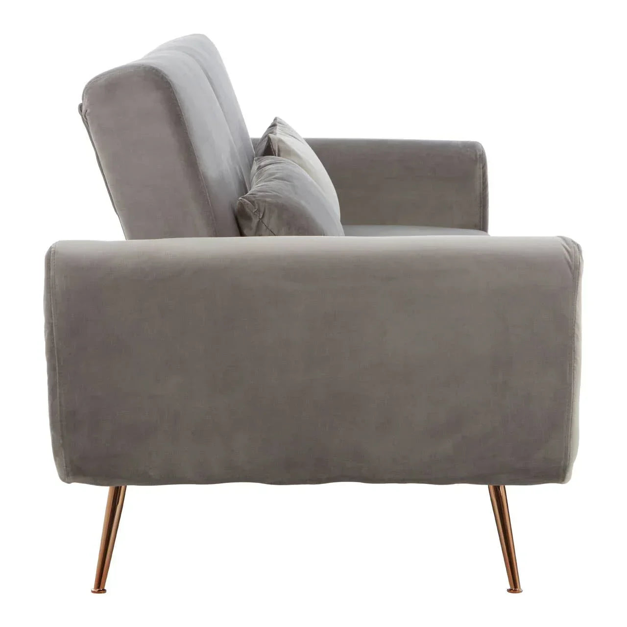 Side view of grey velvet sofa with slim gold metal legs and plush cushions