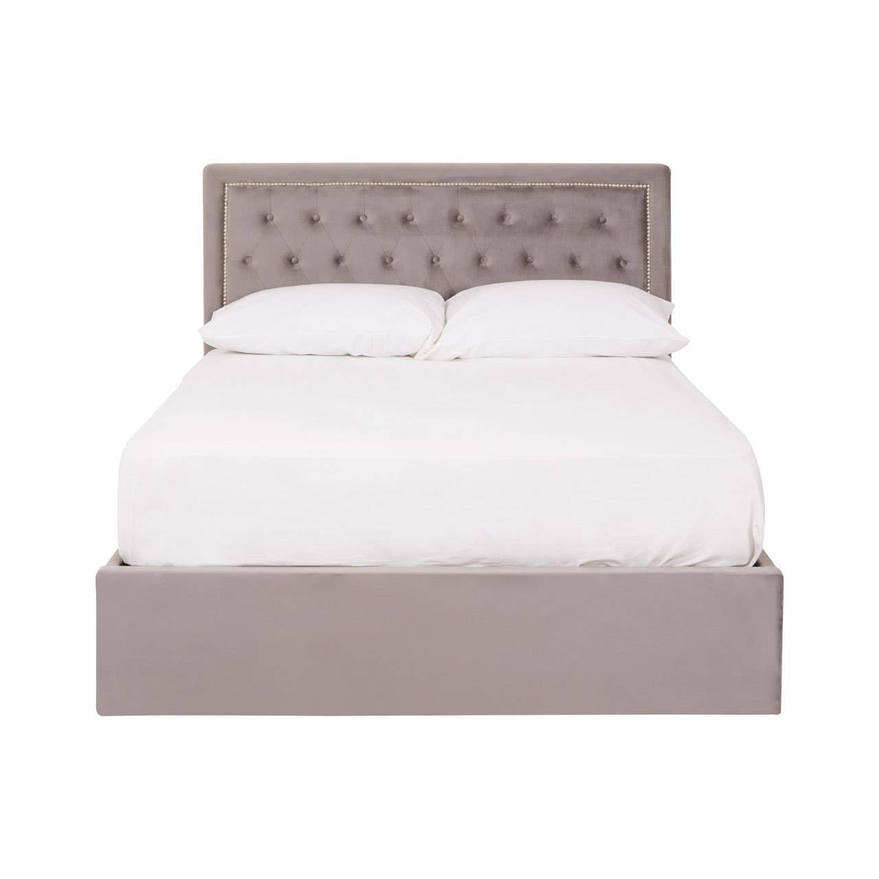 Double bed with a grey velvet upholstered headboard featuring button tufting, complemented by a matching grey velvet base. The bed is styled with a white mattress and bedding, creating a clean and modern look